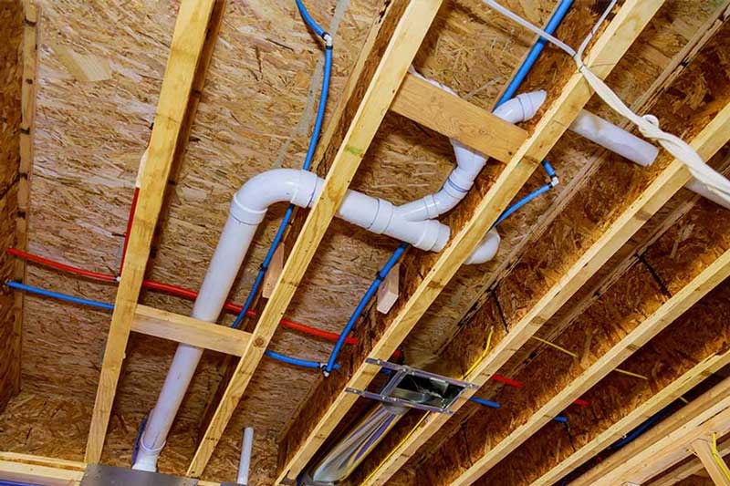 Water line repiping installed through ceiling framing in Brooklyn, NY